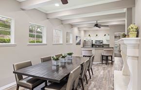 Irving apartment for rent - A modern dining room with a large table and chairs.