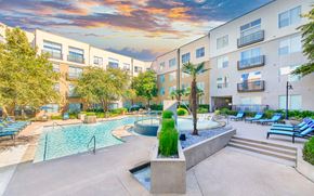 Irving apartment for rent - a courtyard with a pool and an apartment building