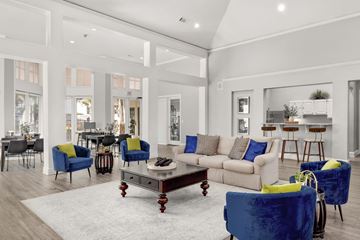Austin apartment for rent - a living room with couches and chairs and a coffee table