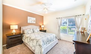 San Antonio apartment for rent - a bedroom with a bed and a ceiling fan