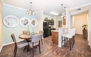 San Antonio apartment for rent - a dining room and kitchen with a table and chairs