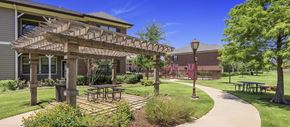 Mansfield apartment for rent - a patio with a pergola in front of a building