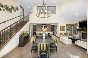 Austin apartment for rent - A dining room with a long table and chairs.