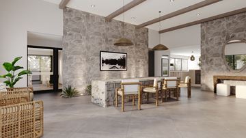 Austin apartment for rent - A modern dining room with a stone wall and wooden furniture.
