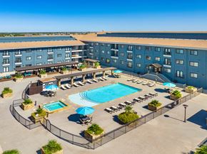 Mckinney apartment for rent - an aerial view of a hotel with a swimming pool