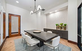 Mckinney apartment for rent - a dining room with a table and chairs and a large window