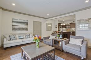 Valley Park apartment for rent - a living room with couches and chairs and a table