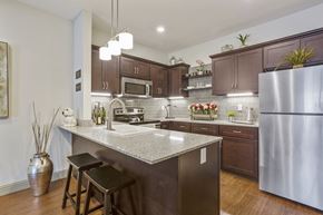 Valley Park apartment for rent - a kitchen with stainless steel appliances and granite counter tops