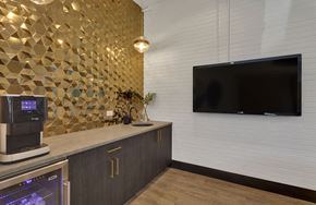 Denver apartment for rent - a kitchen with a counter and a tv on the wall