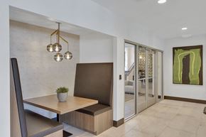 Denver apartment for rent - a dining room with a wooden table and a chair