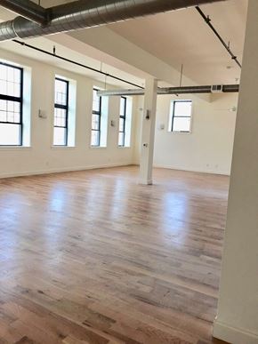 Newark apartment for rent - an empty room with a hard wood floor and white walls