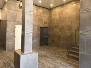 Newark apartment for rent - the lobby of a building with a pillar and stairs
