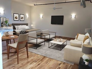 Newark apartment for rent - a living room with a bed and a couch and a table
