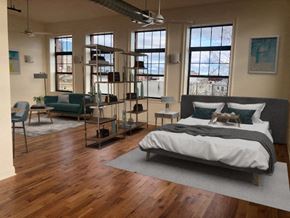 Newark apartment for rent - a bedroom with a bed in the middle of a room