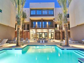 Scottsdale apartment for rent - Scottsdale, AZ, Apartments For Rent - 24-Hour Resort-Inspired Pool With Lounge Chairs, Tables, And Resident Lounge Buliding In The Background.