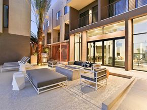 Scottsdale apartment for rent - Apartments for Rent in Scottsdale, AZ - Dusk Scottsdale - BBQ with Fireplace, Outdoor Couch and Chairs with Tanning Chairs.
