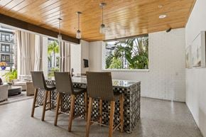 Jacksonville apartment for rent - A dining room with a wooden table and chairs.