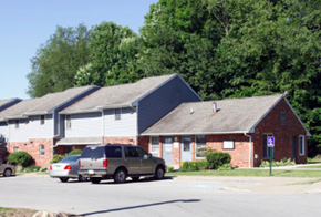 Mercer apartment for rent - A car is parked in front of a house.