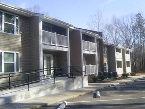 Blackstone apartment for rent - an apartment building with stairs and balconies