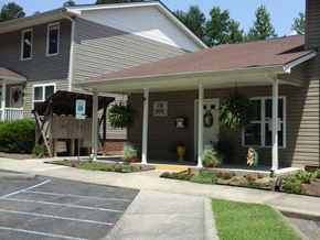 Blackstone apartment for rent - a house with a porch and a parking lot