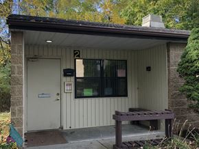 Boonsboro apartment for rent - A small building with a number 2 on the front door.
