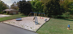 Boonsboro apartment for rent - A playground with a blue swing set and a yellow fire hydrant.