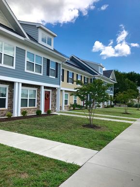 Cambridge apartment for rent - a row of houses with a sidewalk in front of them