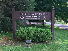 Saxonburg apartment for rent - the sign for isabela estates in front of a park