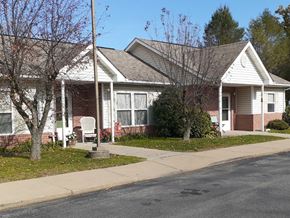 Saxonburg apartment for rent - a brick house with a sidewalk in front of it