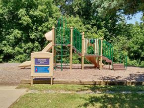 Lawrenceville apartment for rent - a playground with a slide in a park