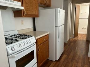 Morgantown apartment for rent - a kitchen with a stove and a refrigerator