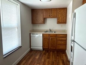 Morgantown apartment for rent - a small kitchen with a sink and a refrigerator