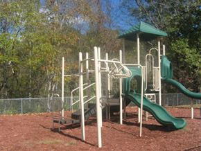 Pineville apartment for rent - a playground with slides and a climbing frame