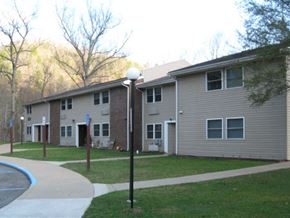 Pineville apartment for rent - an apartment building with a sidewalk in front of it