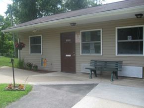 Pineville apartment for rent - a small house with a bench in front of it