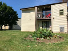 Martinsburg apartment for rent - a house with a flower garden in the yard