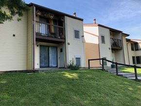 Martinsburg apartment for rent - the back of two houses with a yard