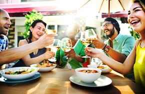 Bridgeport apartment for rent - A group of people toasting with wine glasses at a table.