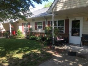 Hebron apartment for rent - A house with a red door and a white porch.