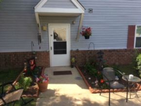 Hebron apartment for rent - A small patio with a table and chairs.
