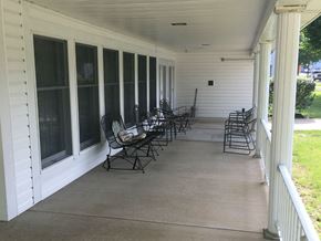 Tionesta apartment for rent - the front porch of a house with rocking chairs