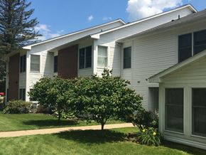 Tionesta apartment for rent - a white house with a tree in front of it