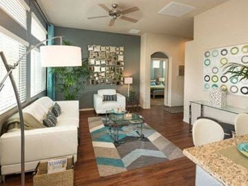 Chandler apartment for rent - a living room filled with furniture and a ceiling fan