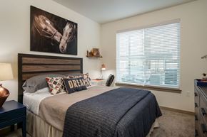 Maple Valley apartment for rent - a bedroom with a bed and a painting of a horse