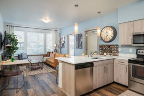 Maple Valley apartment for rent - a kitchen and living room with a clock on the wall