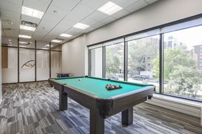 Hamilton apartment for rent - A pool table in a room with a view of the city.