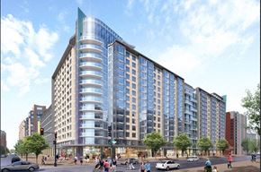 Washington apartment for rent - A large, modern building with a curved glass facade is depicted in the image.