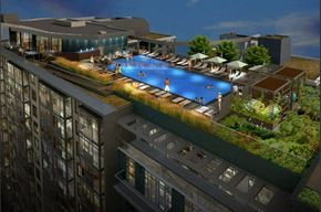 Washington apartment for rent - A rooftop pool with people in it.