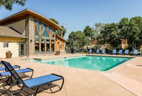 Aurora apartment for rent - Apartments for Rent in Aurora, Colorado - Copper Flats - Swimming Pool with Spacious Sundeck, Lounge Chairs, Tables, and Manicured Greenery.