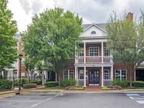 Atlanta apartment for rent - a large brick house with trees in front of it